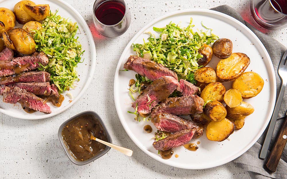Steak & Peppercorn Sauce with roasted potatoes & buttery Brussels sprouts,